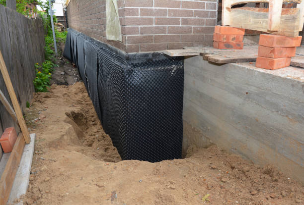 SJ Waterproofing Pros technician performing targeted Exterior Waterproofing assessment in Decatur, TN